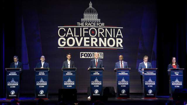 Gubernatorial candidates, from left, Xavier Becerra, Steve Hilton, Matt Mahan, Tom Steyer, Tony Thurmond, Antonio Villaraigosa and Betty Yee participate in a debate in San Francisco last month. Candidates in the race are generally pushing to build more homes and do so faster. 